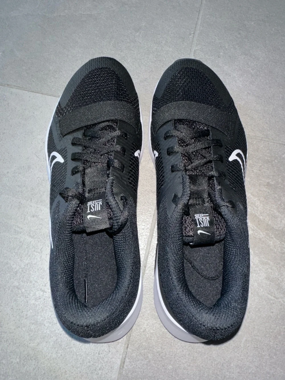 Nike Black Athletic Shoes with White Swoosh